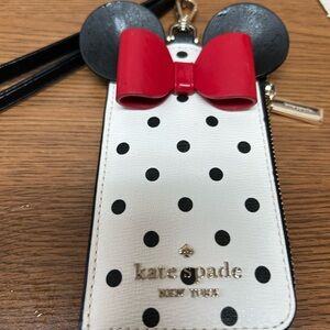 Brand new, never used,  zipper pocket for a few more cards. Has leather strap